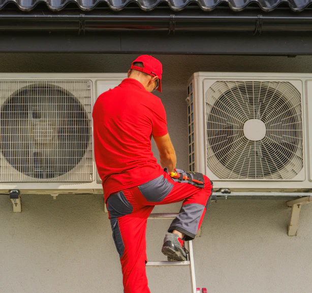 hvac technician doing maintenance